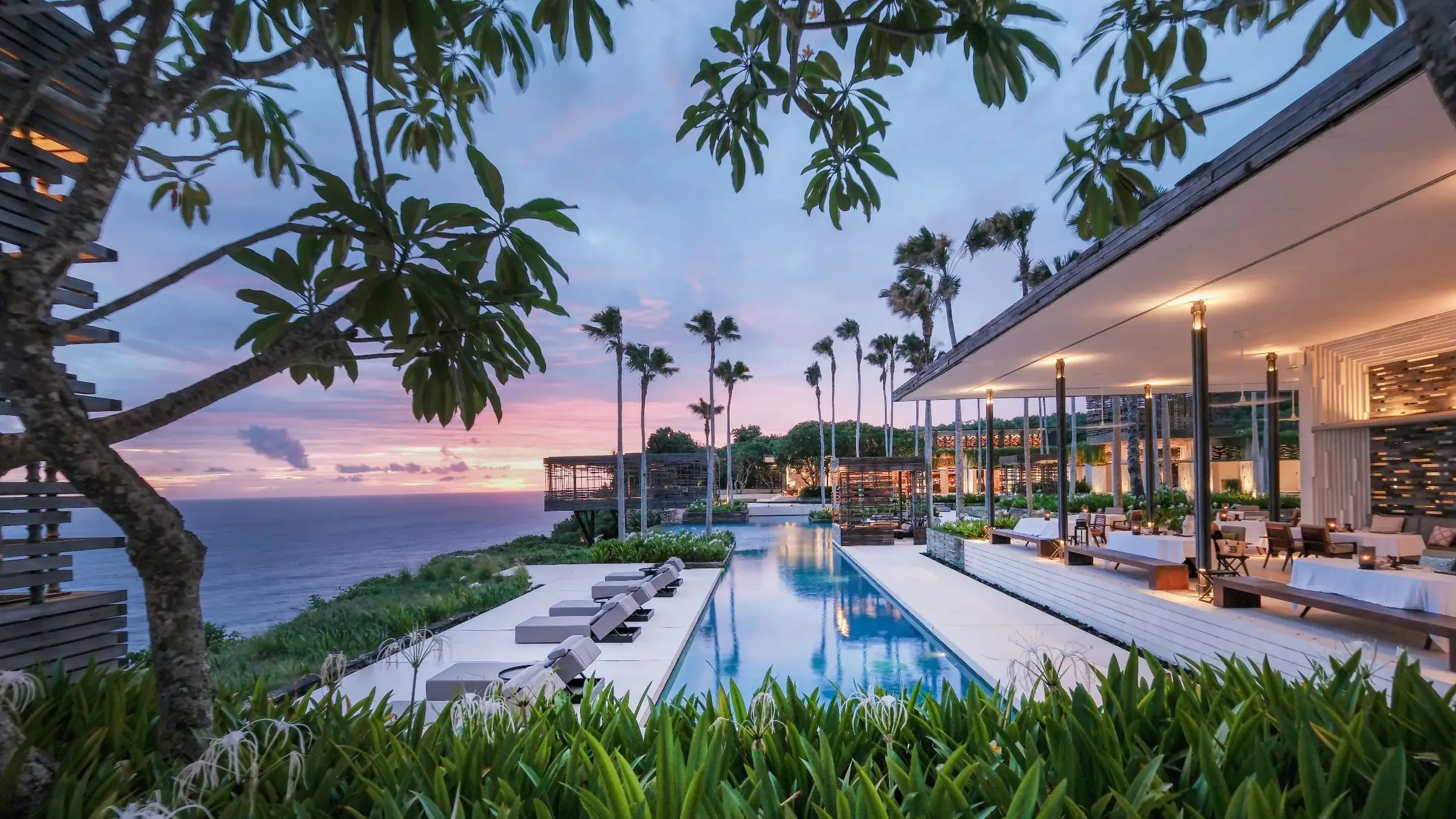 Clifftop resort pool at sunset