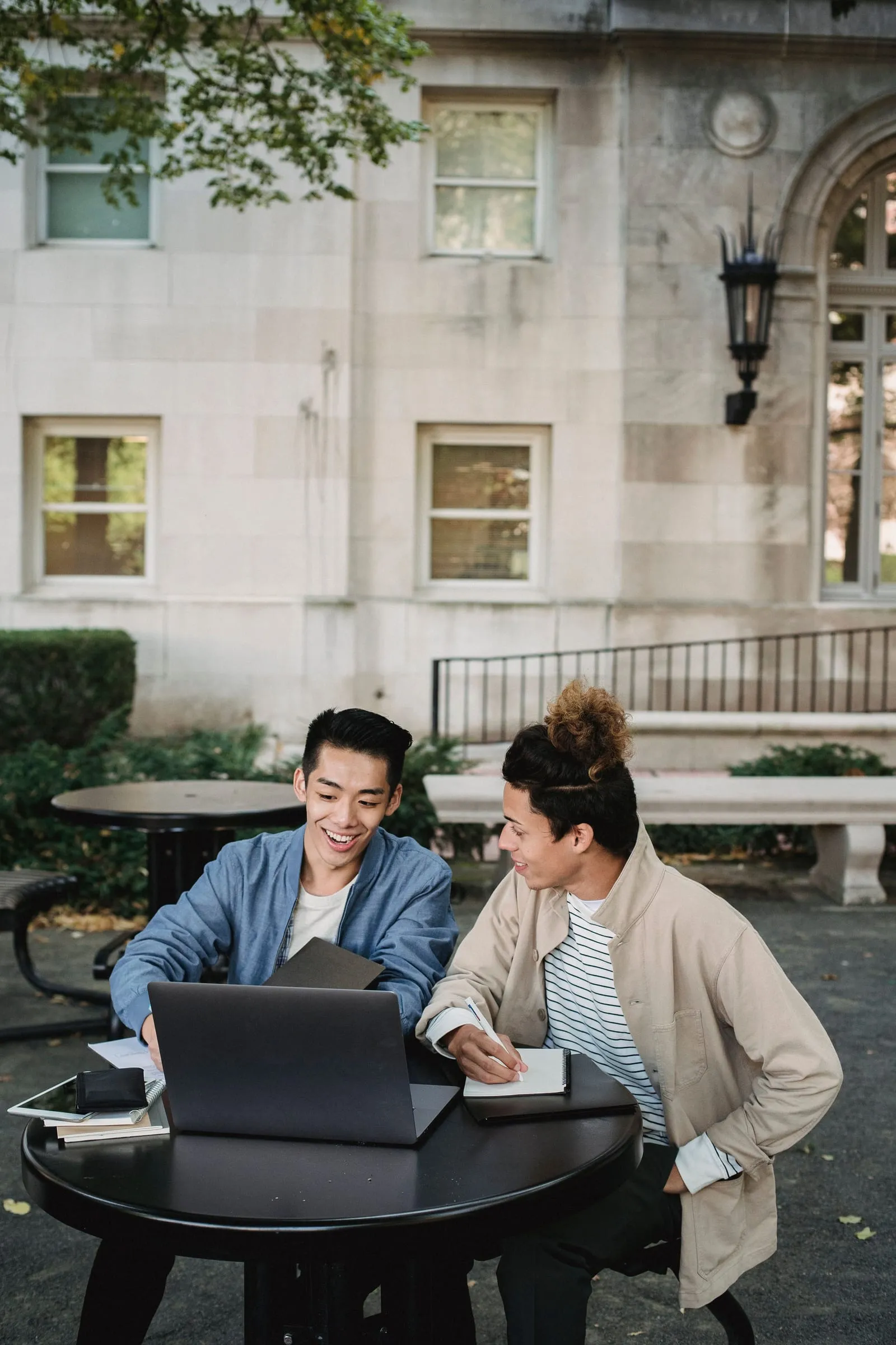 Two students working together on campus
