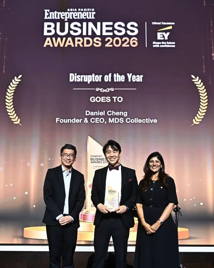 Daniel Cheng receiving the Disruptor of the Year award