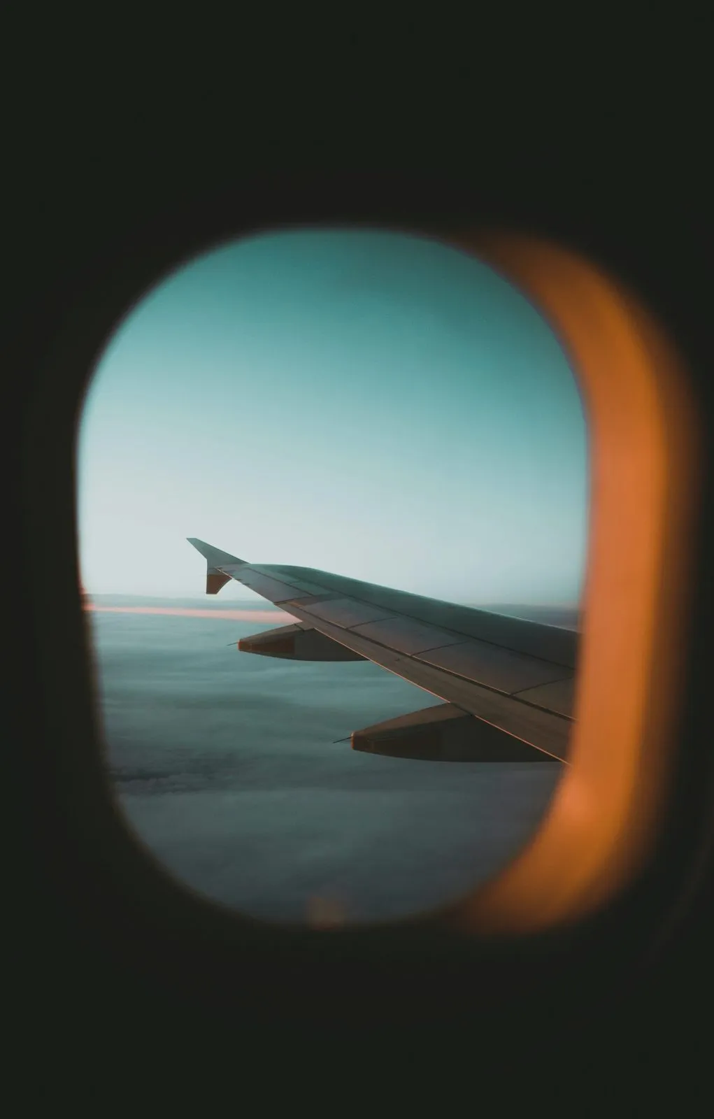 Aircraft wing at sunset
